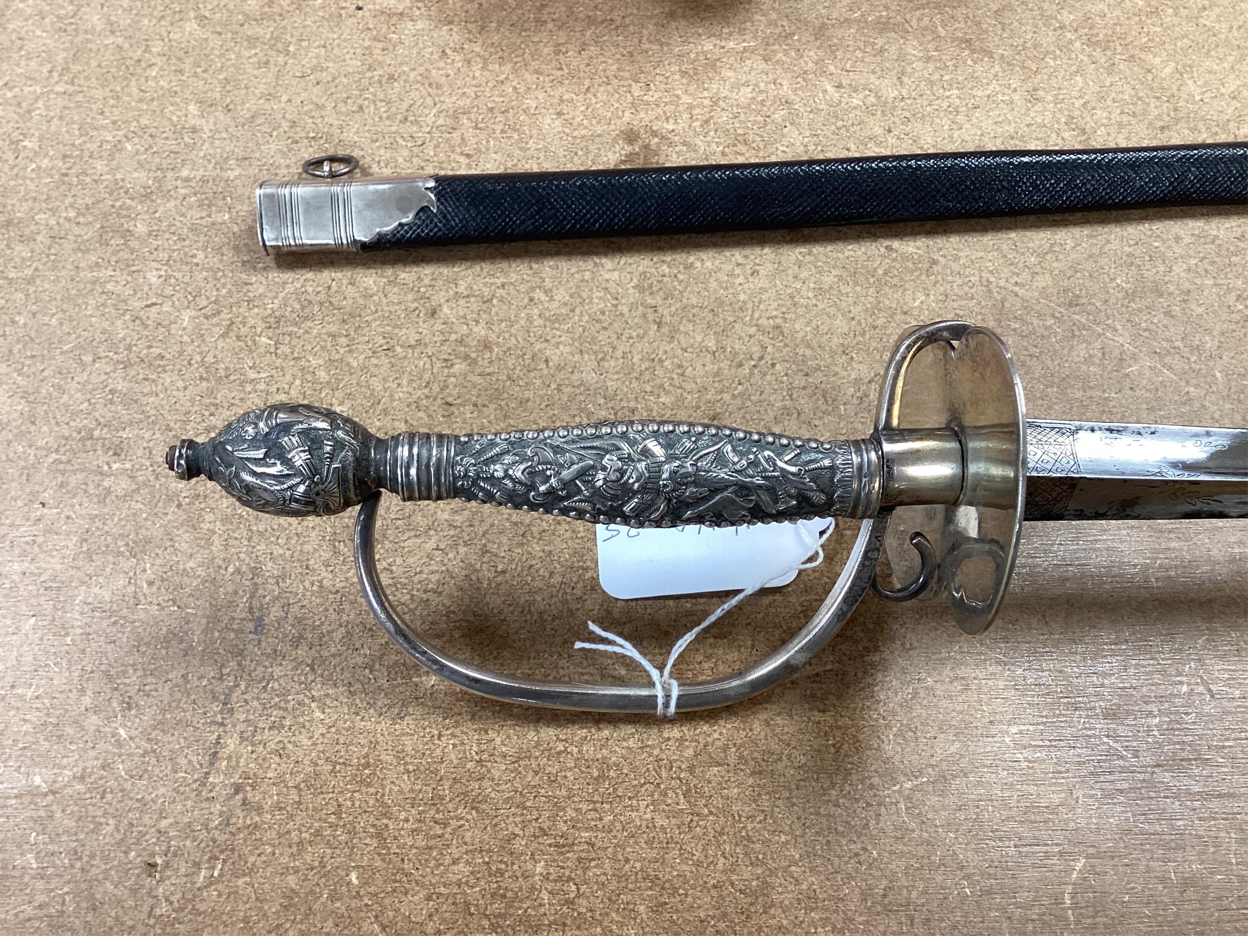 A late 18th century court sword with white metal grip, knuckle guard and mounts, decoration to scabbard band believe to be based on Admiral Duncan’s crest (Camperdown 1797), blade 84cm. Condition - fair to good, some wea